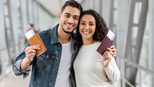 happy-travellers-young-arab-couple-with-passports-2022-10-07-01-29-15-utc-scaled